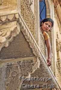 Girl at a high window 